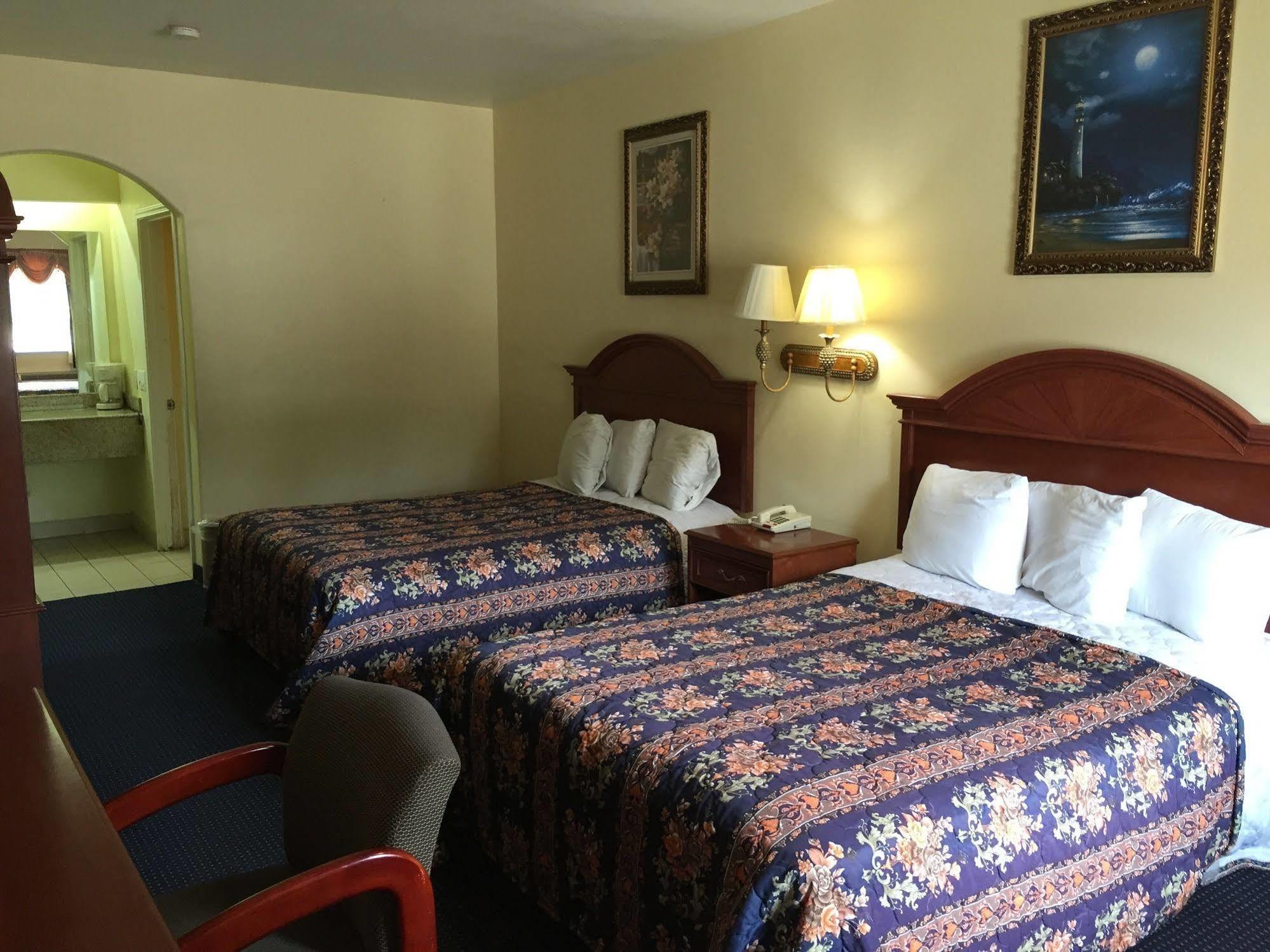 Executive Inn & Suites Shepherd Экстерьер фото